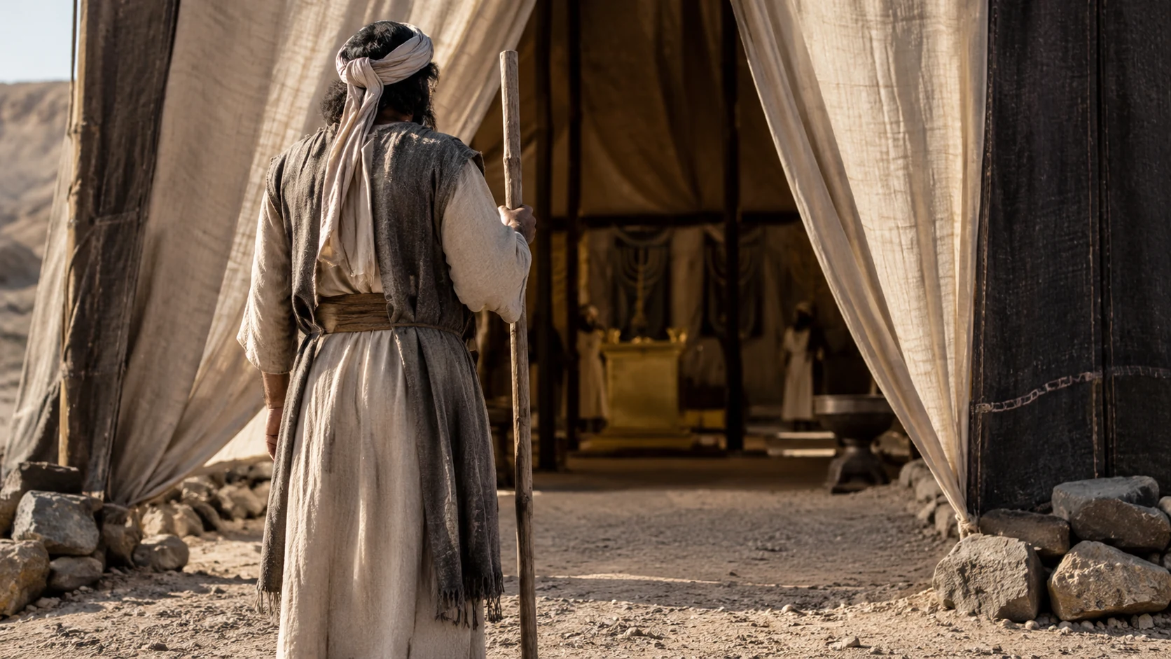 A keeper stands outside the tent entrance.