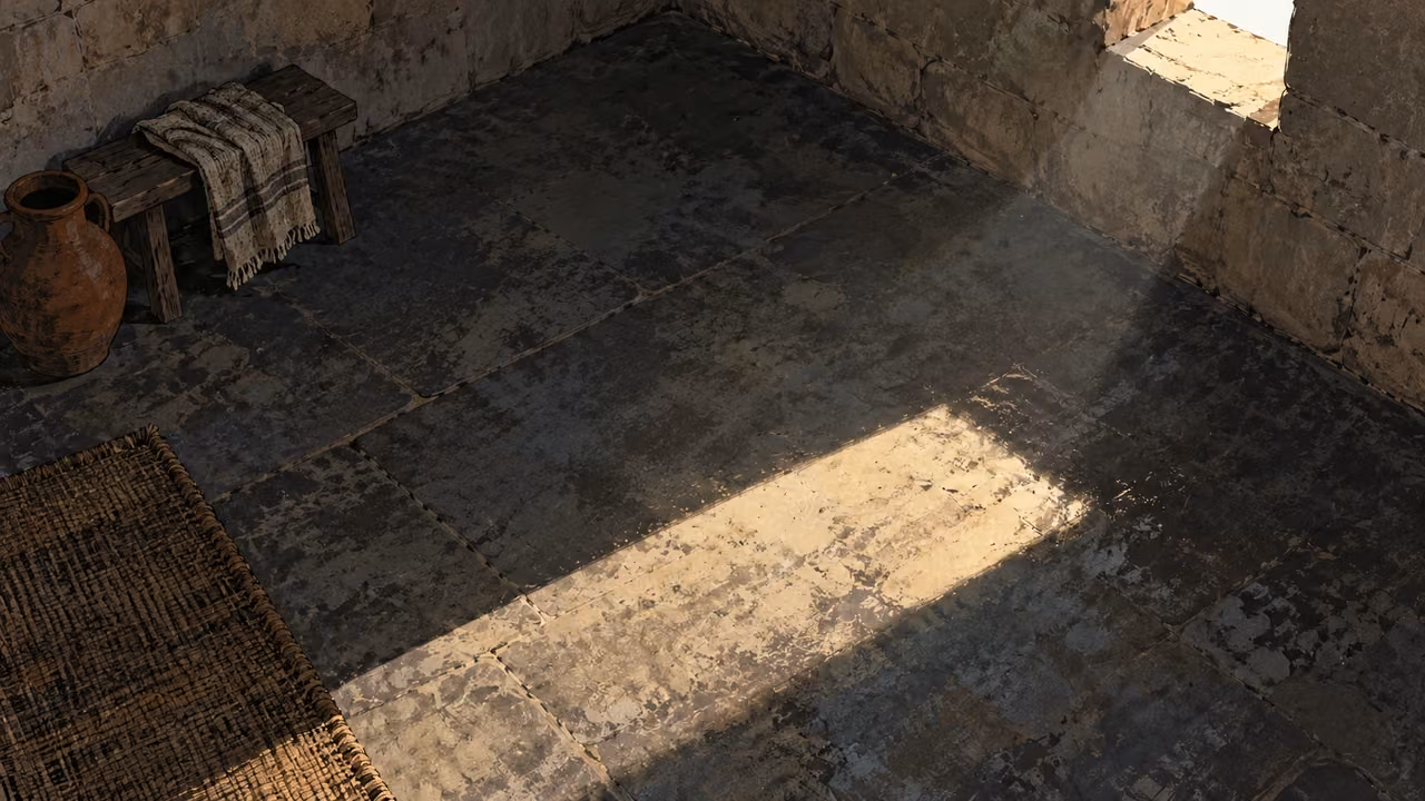 Daylight from a high opening falls across an empty stone room.